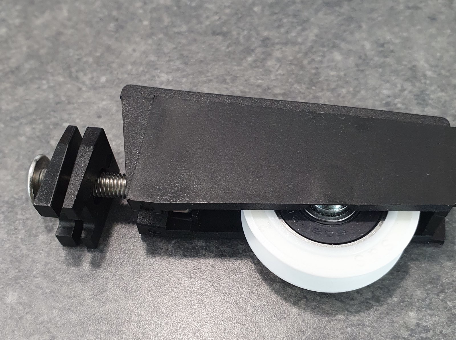 New sliding door roller assembly