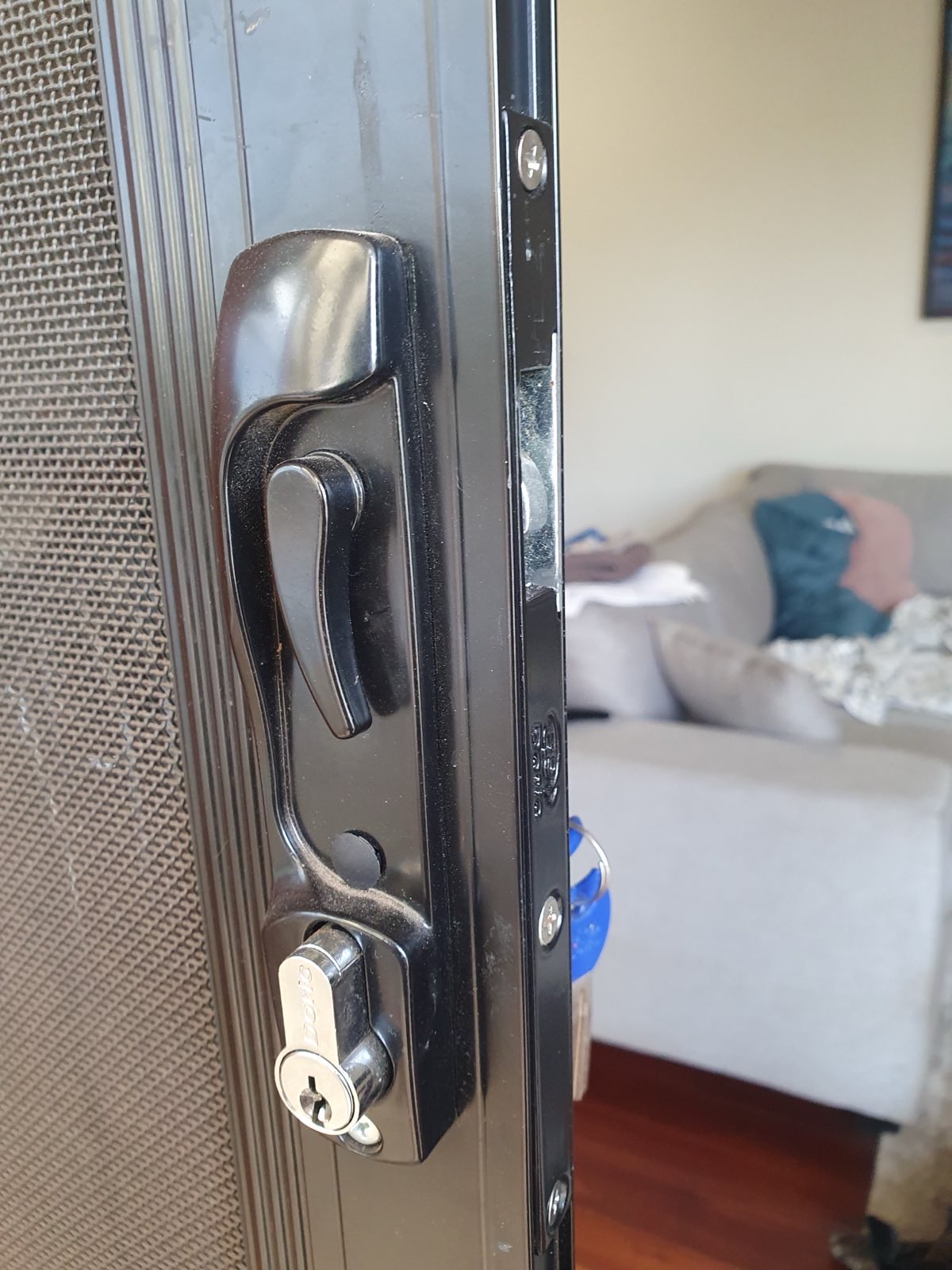 Newly installed security door handle with key lock